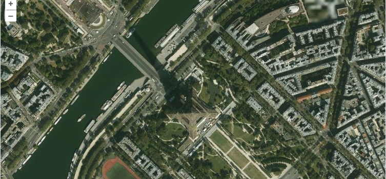 Satellite aerial view of the Eiffel Tower and central Paris as an OpenLayers raster tile layer.
